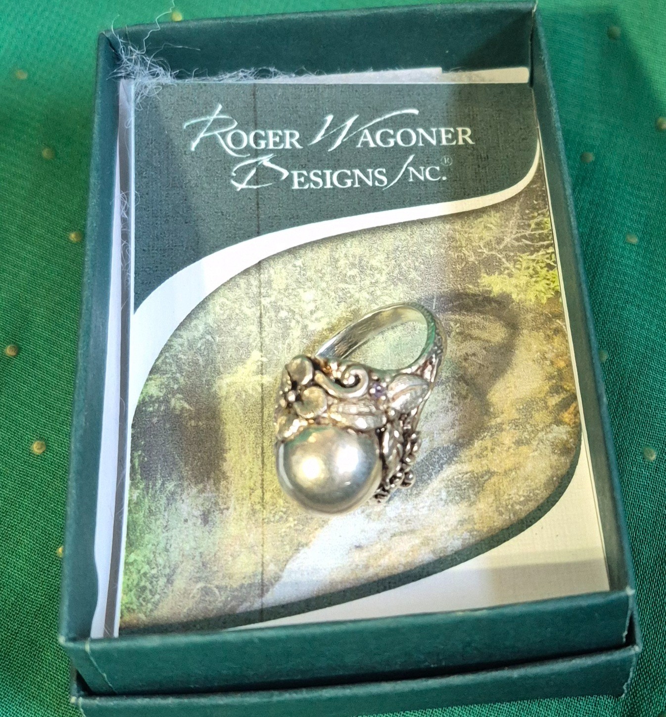 sterling silver ring by Roger Wagoner Designs features an organic, floral-inspir