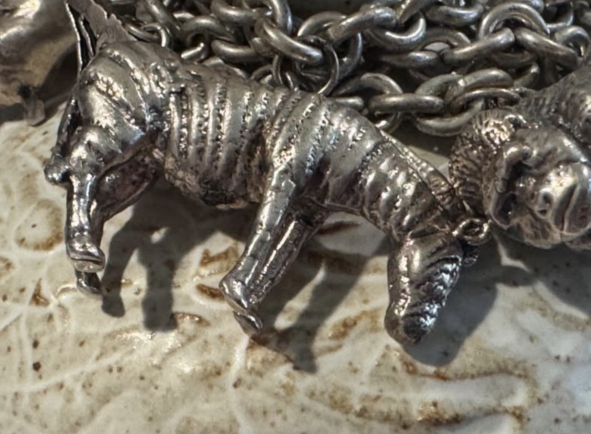 Signed Susan Cummings statement sterling silver African animal charm bracelet