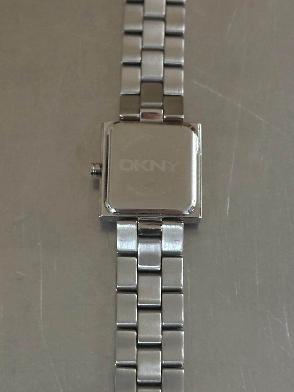 DKNY Watch Women’s Analog Square Silver Tone Quartz Water Resistant 7 inch 22 mm