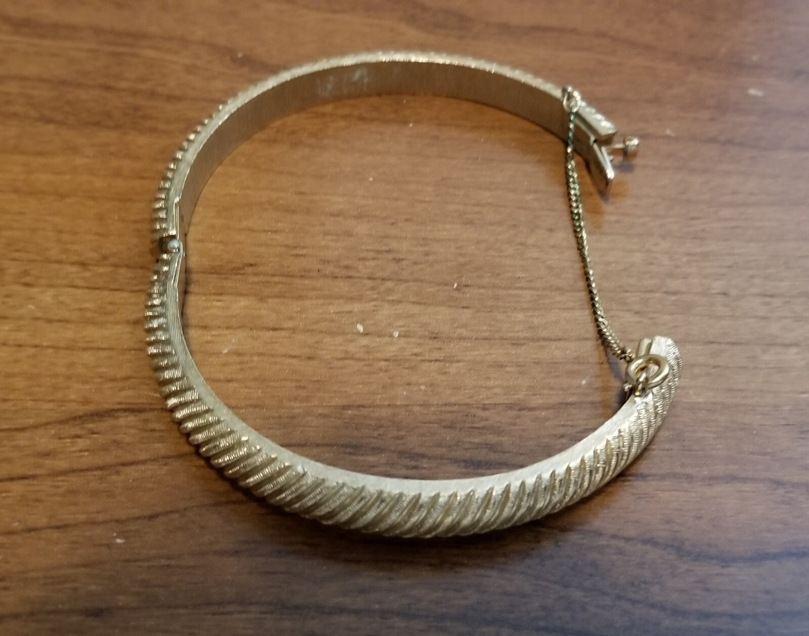 Vintage Crown Trifari Gold Hinged Bangle Bracelet With Safety Chain.