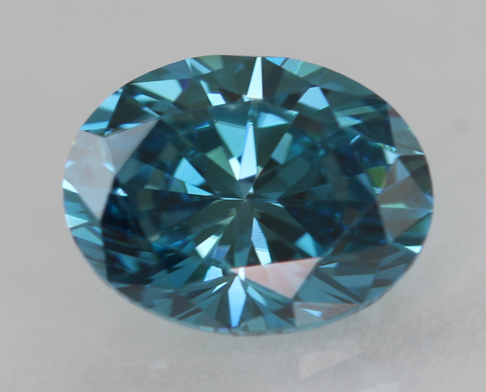Cert 0.57 Carat Fancy Vivid Blue VVS1 Oval Natural Enhanced Diamond 5.99×4.63mm