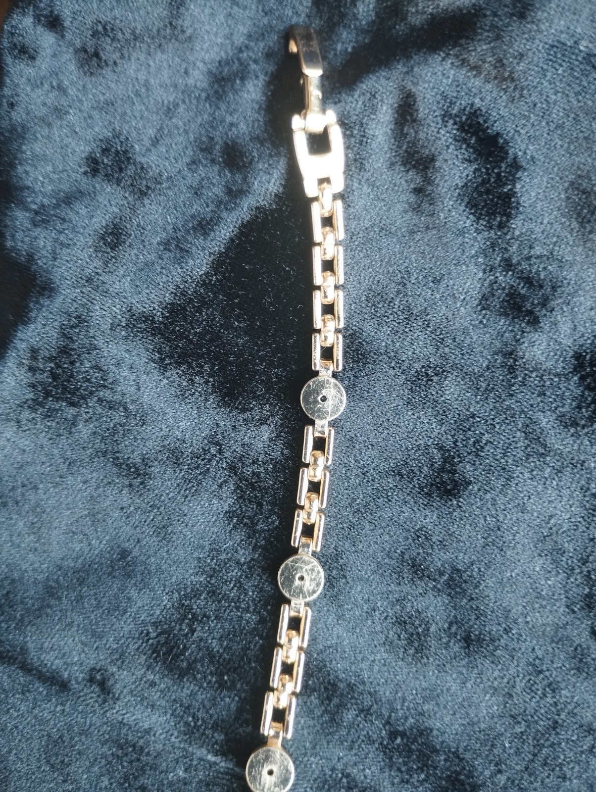 Gold-colored bracelet.