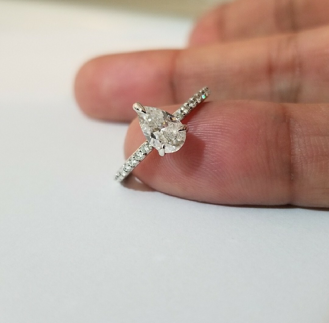 1.50 CARAT FOREVER ONE MOISSANITE PEAR SHAPE CHARLES & COLVARD RING