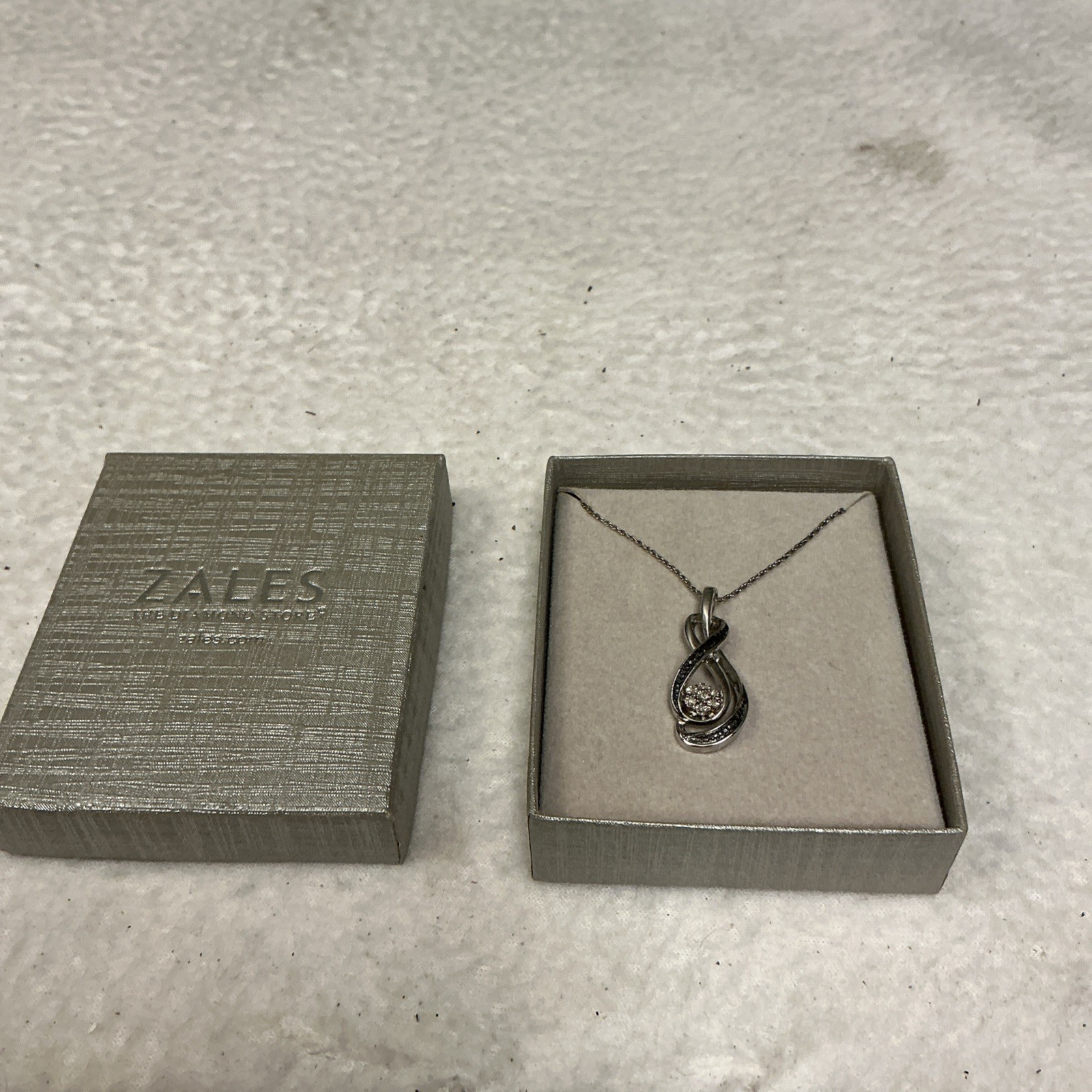 Zales Sterling Silver Diamond Accent 7 Stone Infinity Pendant Necklace, 18″ 3601