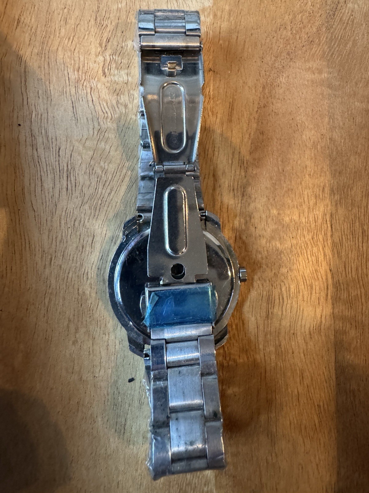 Analog wristwatch silver metal band brushed case black dial video game theme