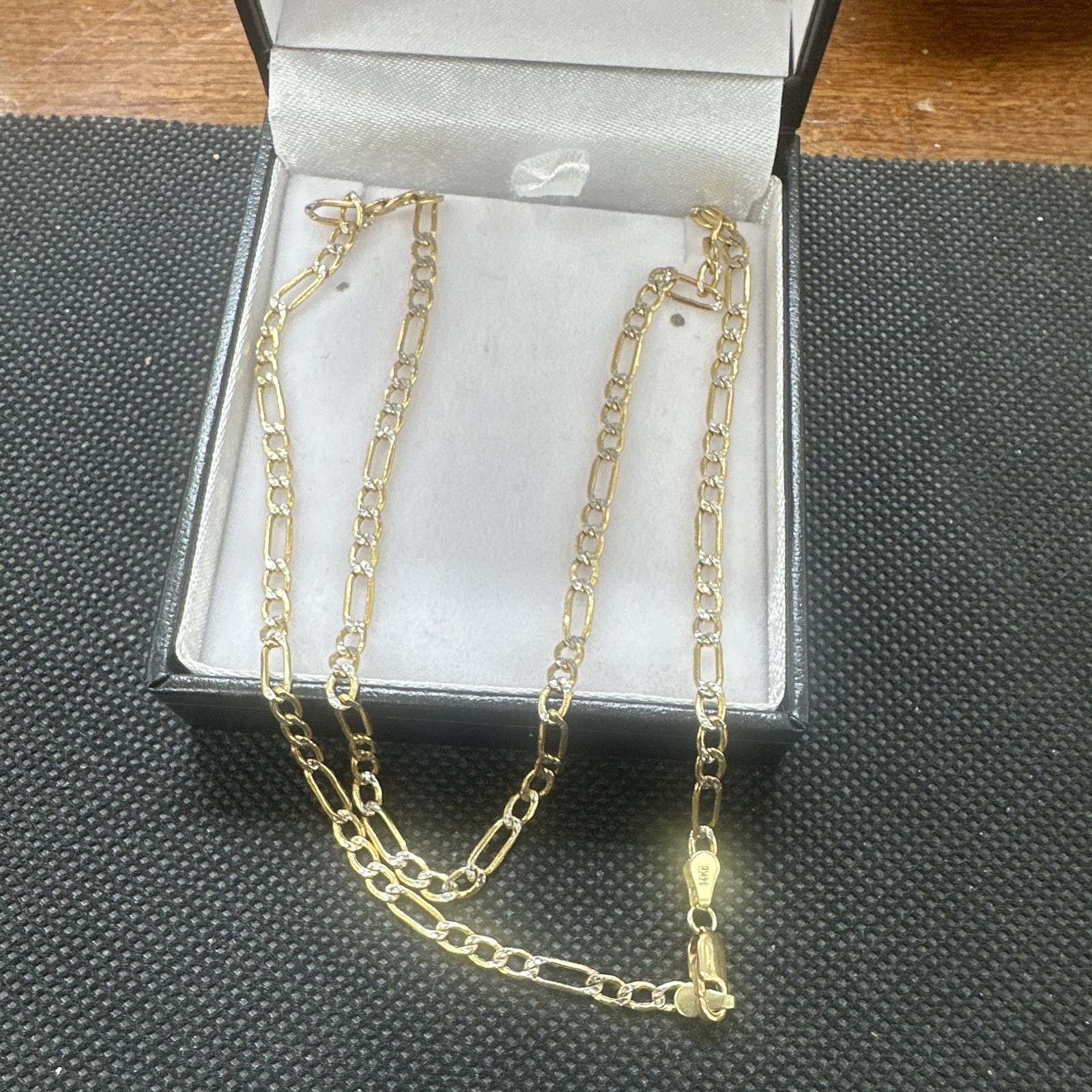 14 k solid Gold 18inches Figuro Diamond cut Chain.