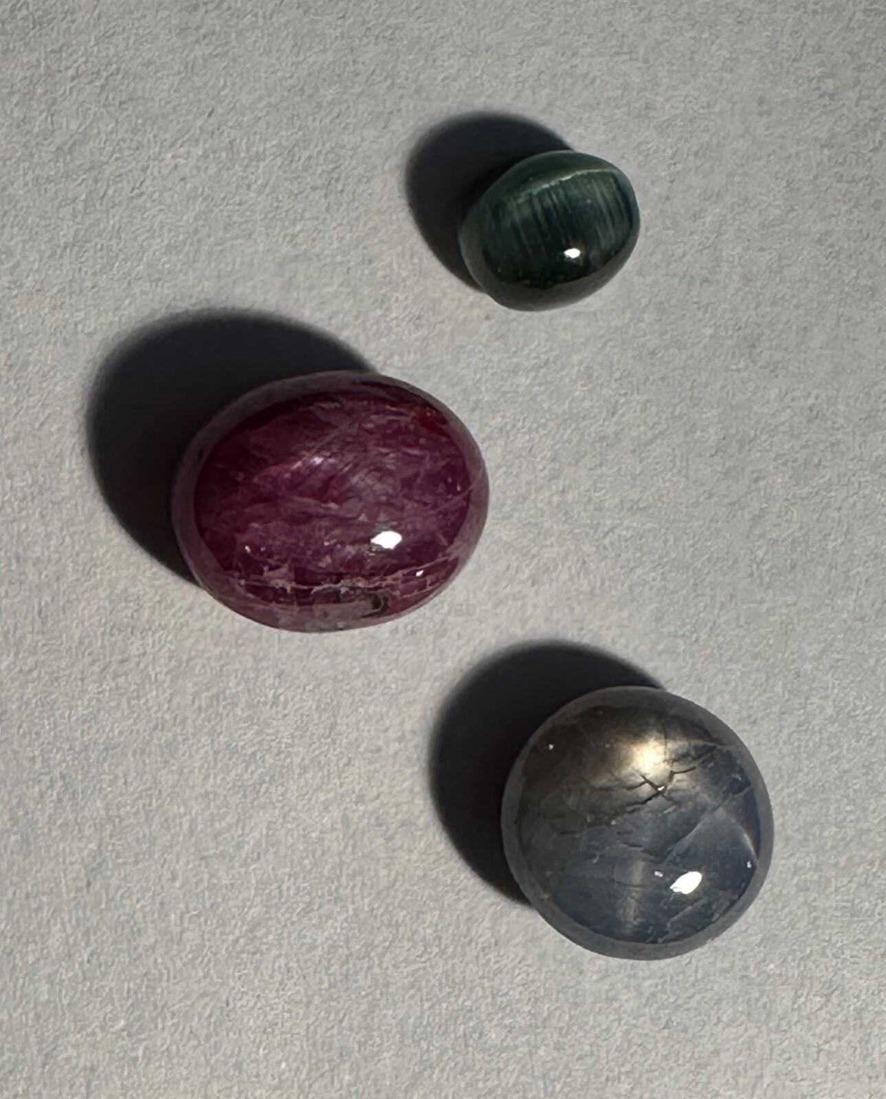 STAR SAPPHIRE CABOCHON 5.25CT, STAR RUBY SAPPHIRE 6.71CT, CAT’S EYE TOURMALINE 1