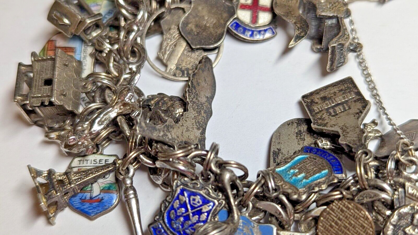 VINTAGE STERLING SILVER CHARM BRACELET WITH ABOUT 35 CHARMS WEIGHS 94.4 GRAMS