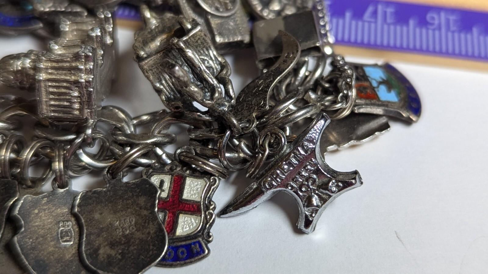 VINTAGE STERLING SILVER CHARM BRACELET WITH ABOUT 35 CHARMS WEIGHS 94.4 GRAMS