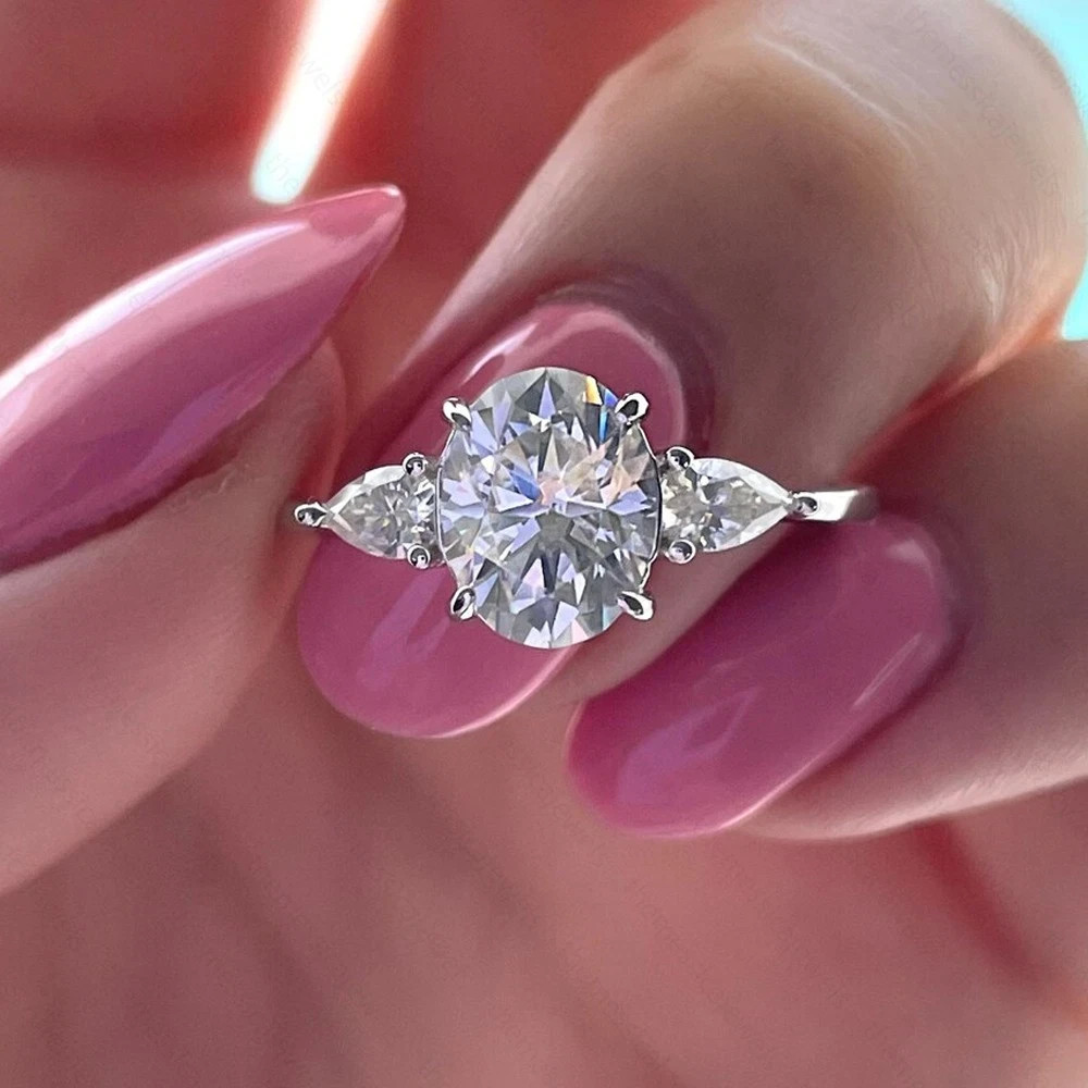 3.10 TCW Oval Cut Moissanite Three Stone Engagement Ring 14K White Gold Plated