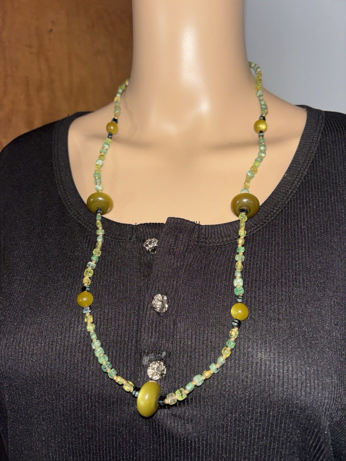 multi-stone beaded necklace featuring various green and yellow beads
