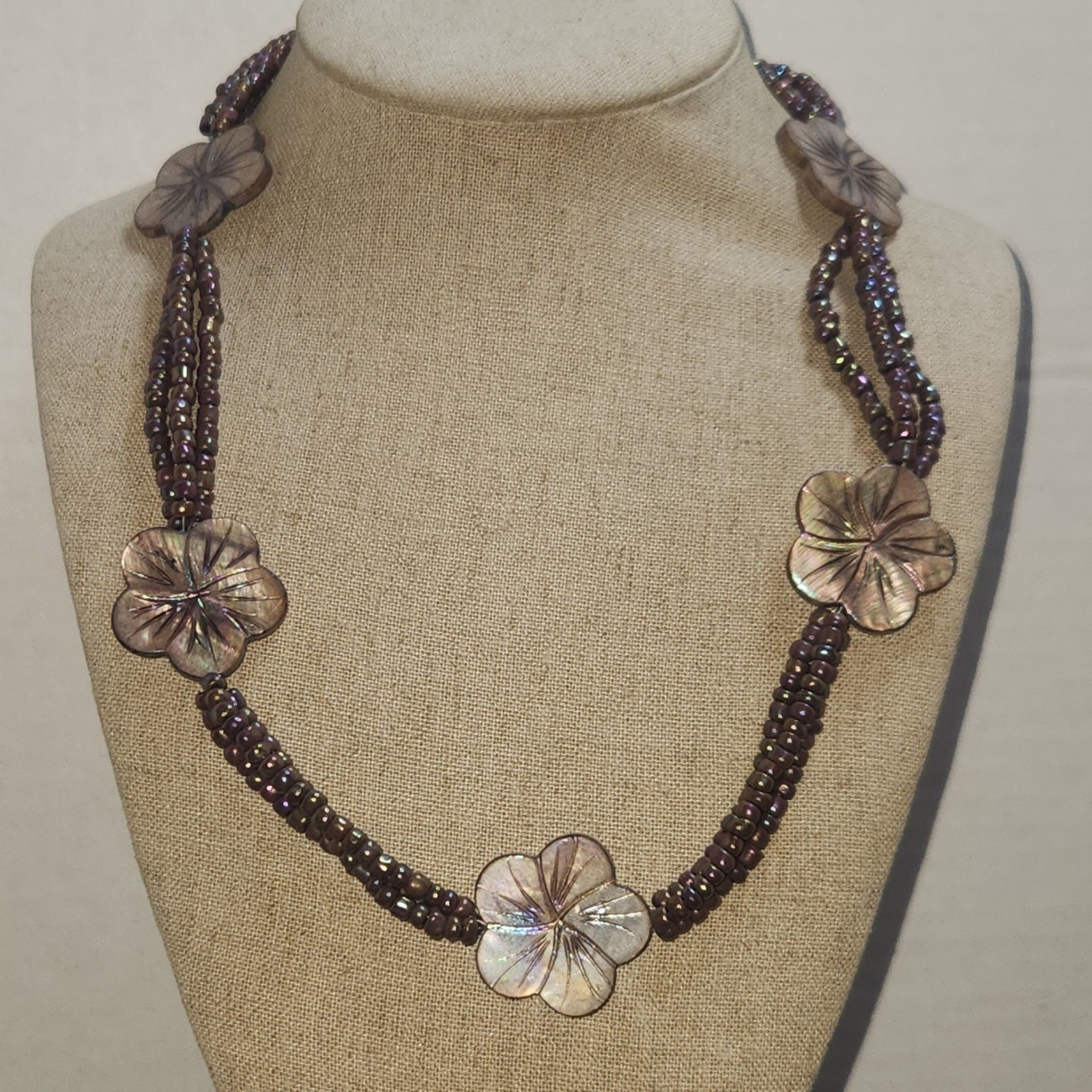 Iridescent Mauve Multi Strand Seed Bead Necklace Carved Shell Flower Toggle 21in