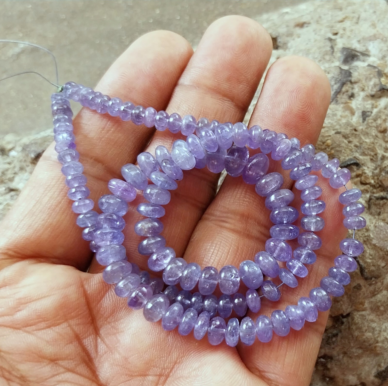 141 Carat 4.5 to 8 MM Natural Light Blue Color Smooth Tanzanite 17 Inch Beads