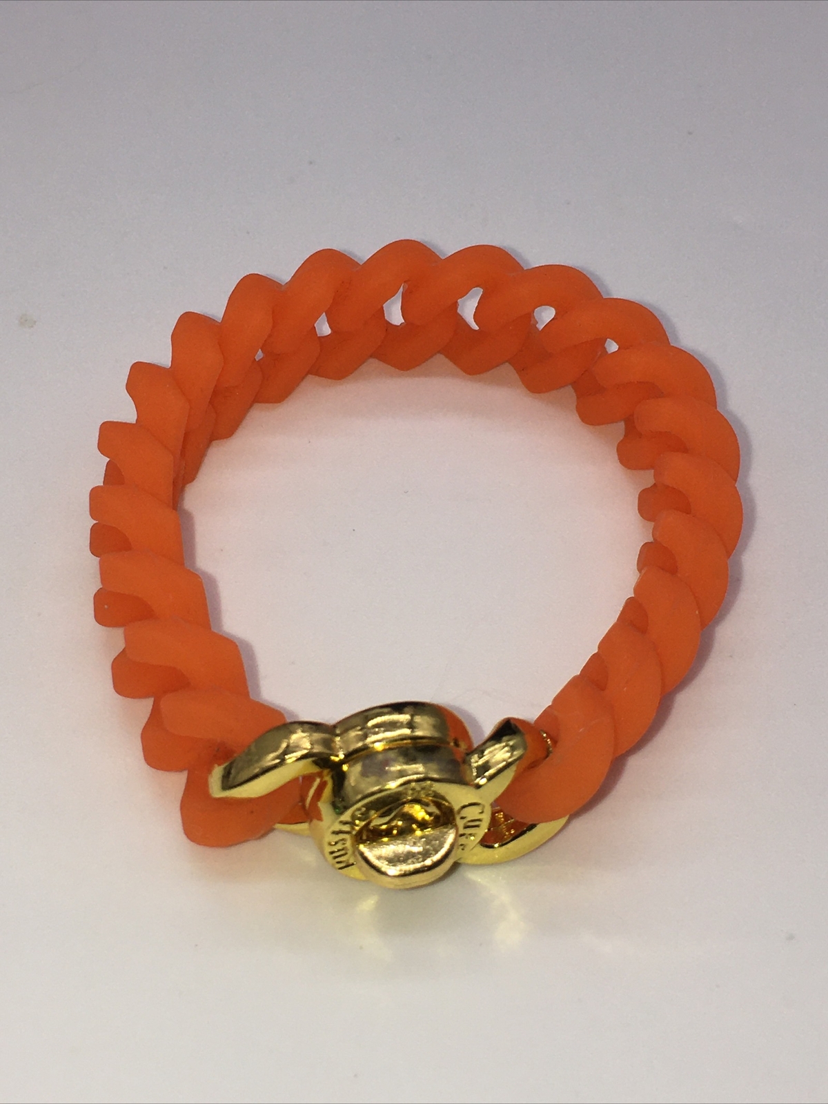 Rustic Cuff Gold Tone Logo Turn Lock Orange Silicone Stretch Mock Chain Bracelet