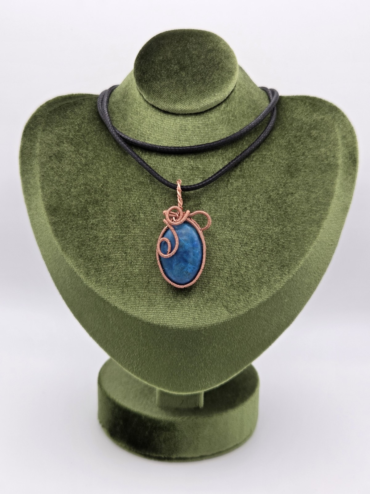 Handcrafted copper wire-wrapped blue Orchid stone pendant