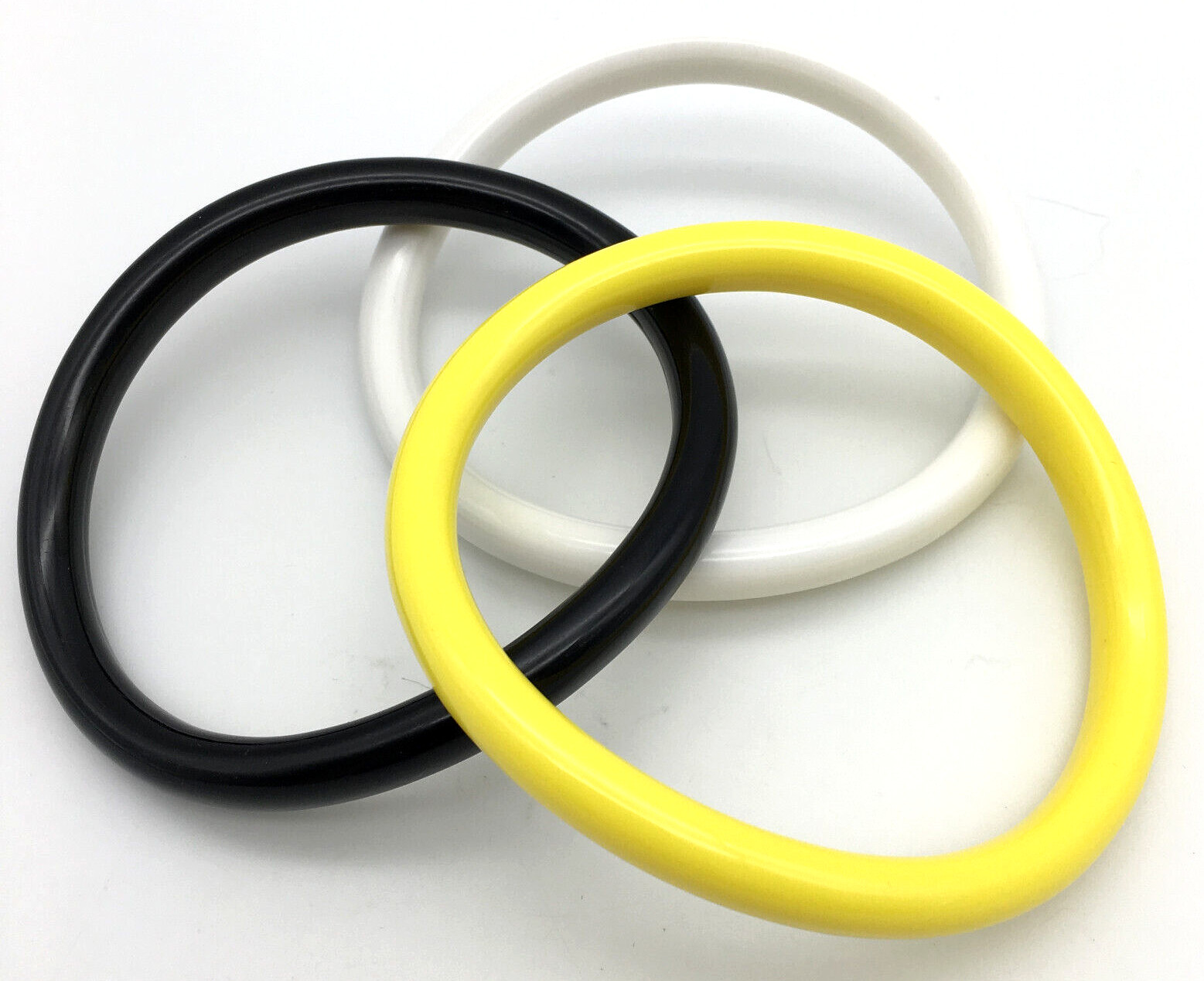 Lot of 3 Bracelets, Yellow, White & Black Lucite Wavy Bangle Bracelets