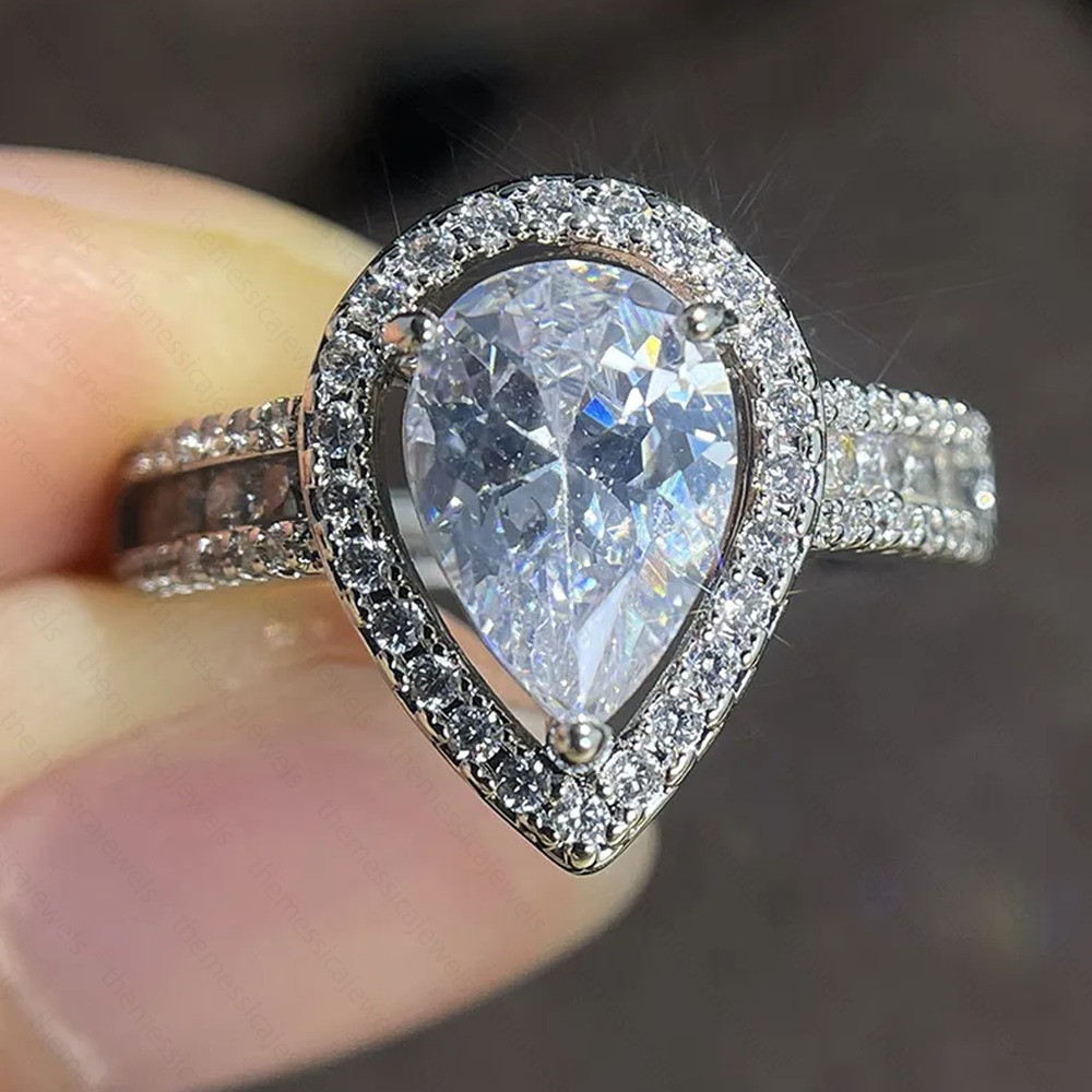 2.76 TCW Pear Brilliant Moissanite Halo Engagement Ring In 14K White Gold Plated