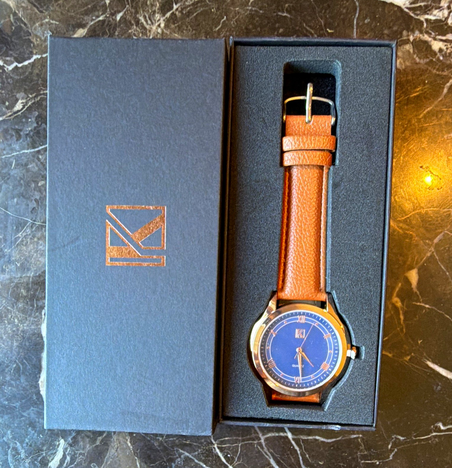 Quartz Analog Wristwatch Blue Dial Brown Leather Strap Roman/Stick Indices Box