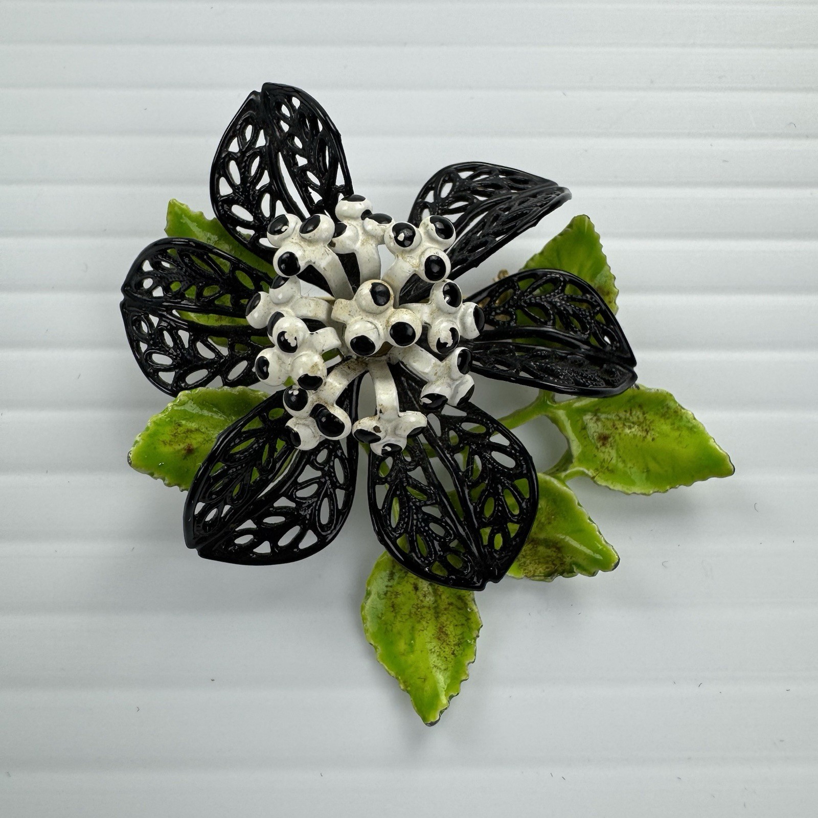 Vintage Enamel Flower Brooch Black White Green Filigree Leaf Statement Pin