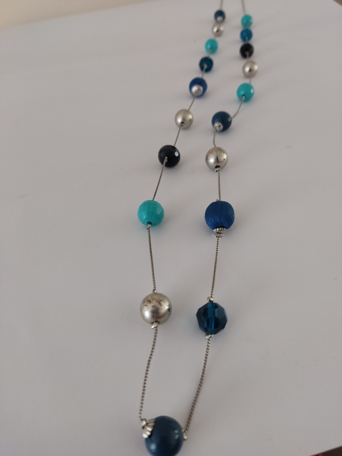 Accessorize long mixed bead blue Turquoise Navy necklace.