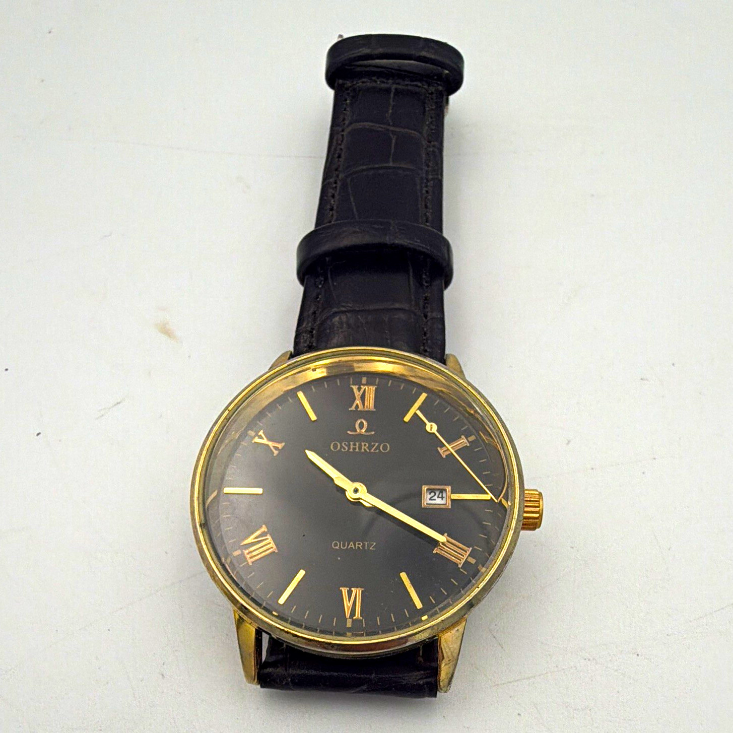OSHRZO Quartz Analog Dress Watch Black Dial Roman Numerals Date Gold Case