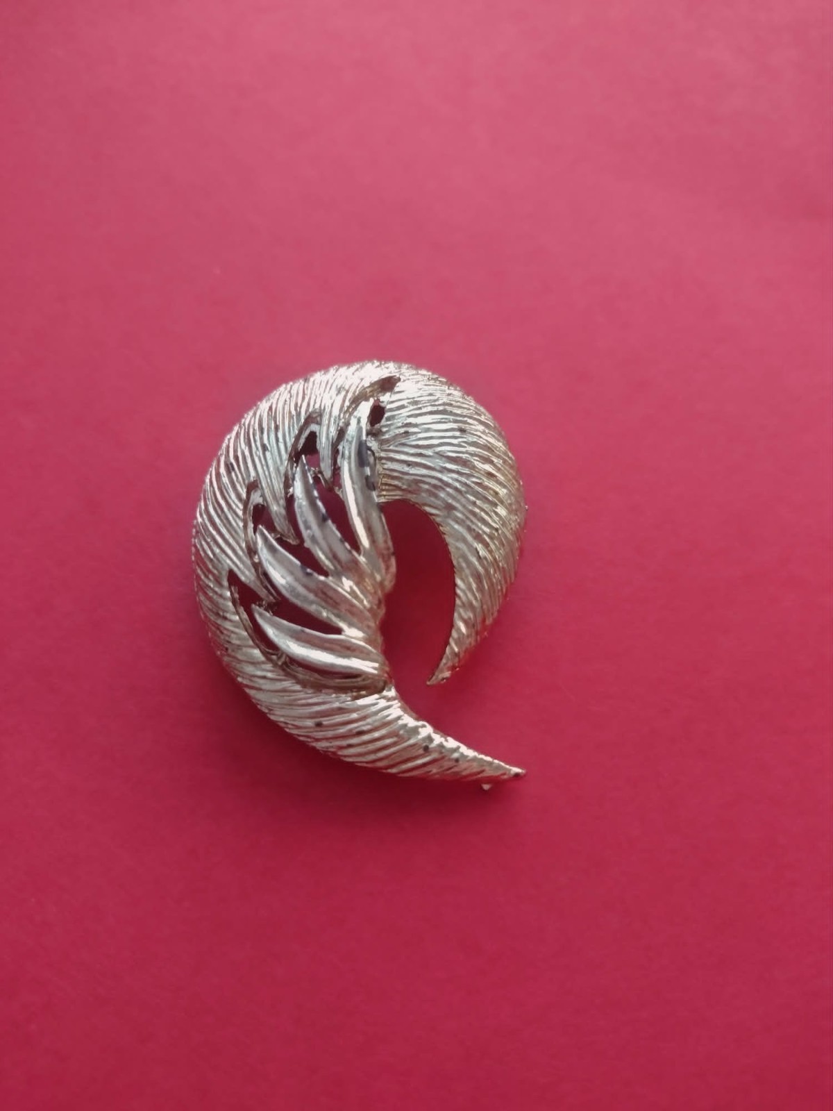 Golden feather brooch