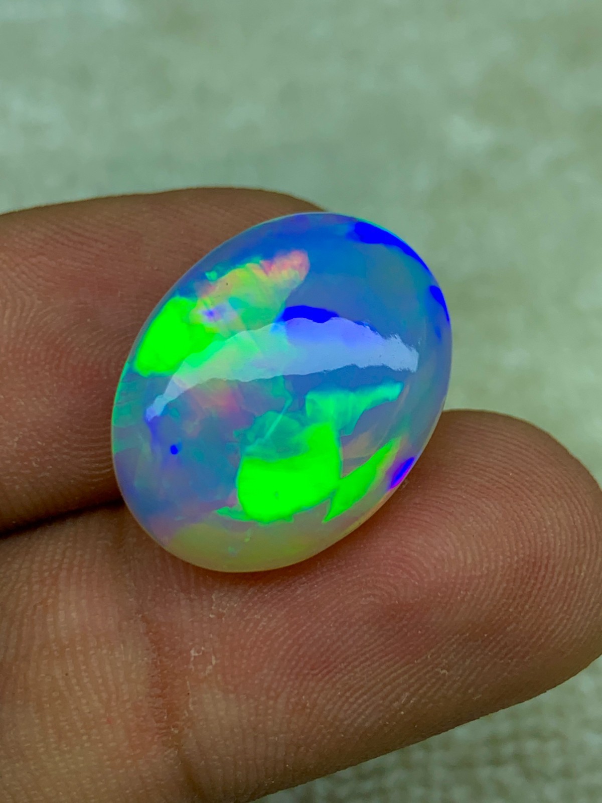 Natural Ethiopian Opal 8.30 Carat Oval Cabochon Rainbow Fire Welo Gemstone