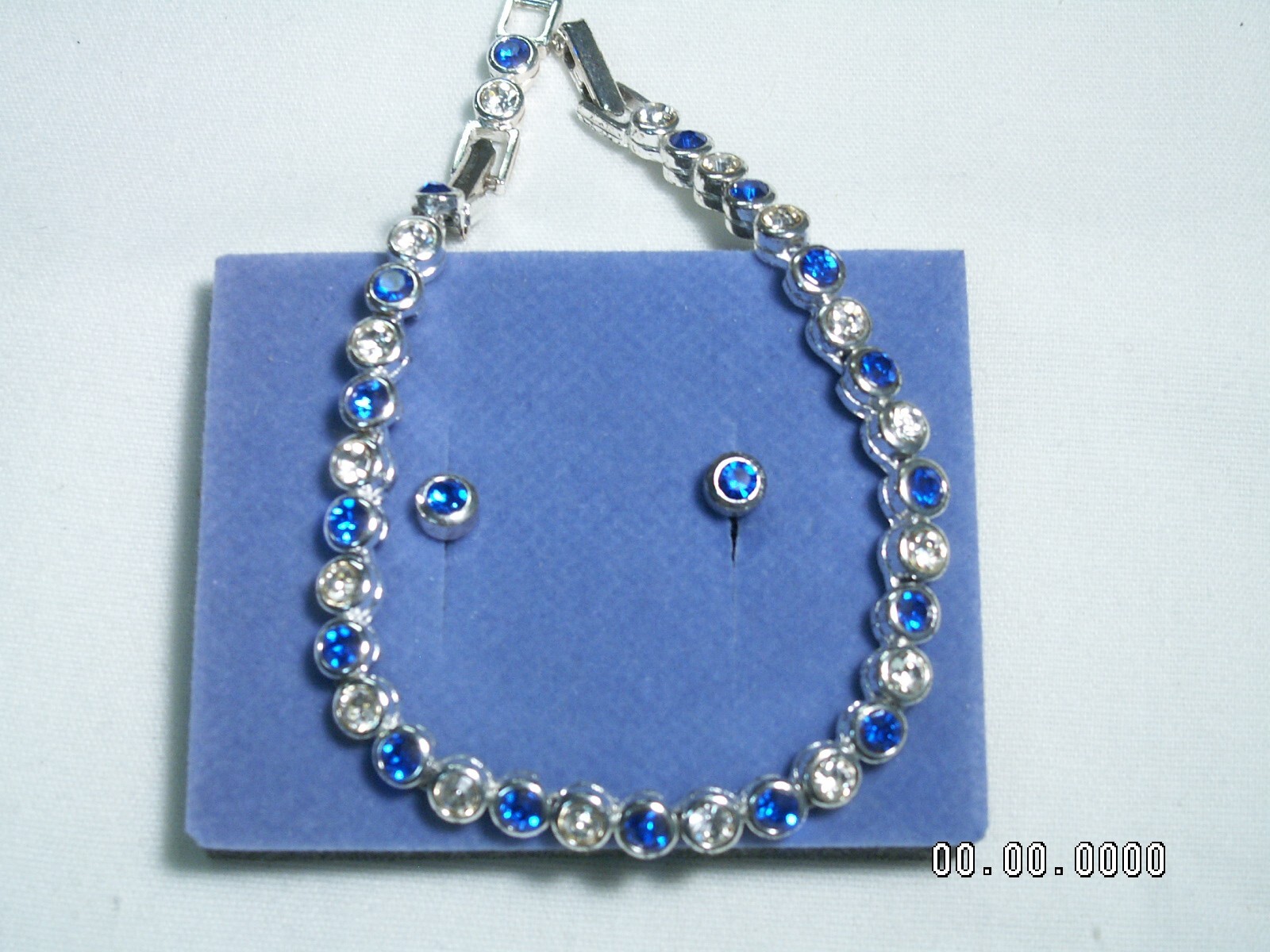 2002 AVON…Silver Tone,Sapphire Blue Crystals Bracelet & Pierced Earrings Set