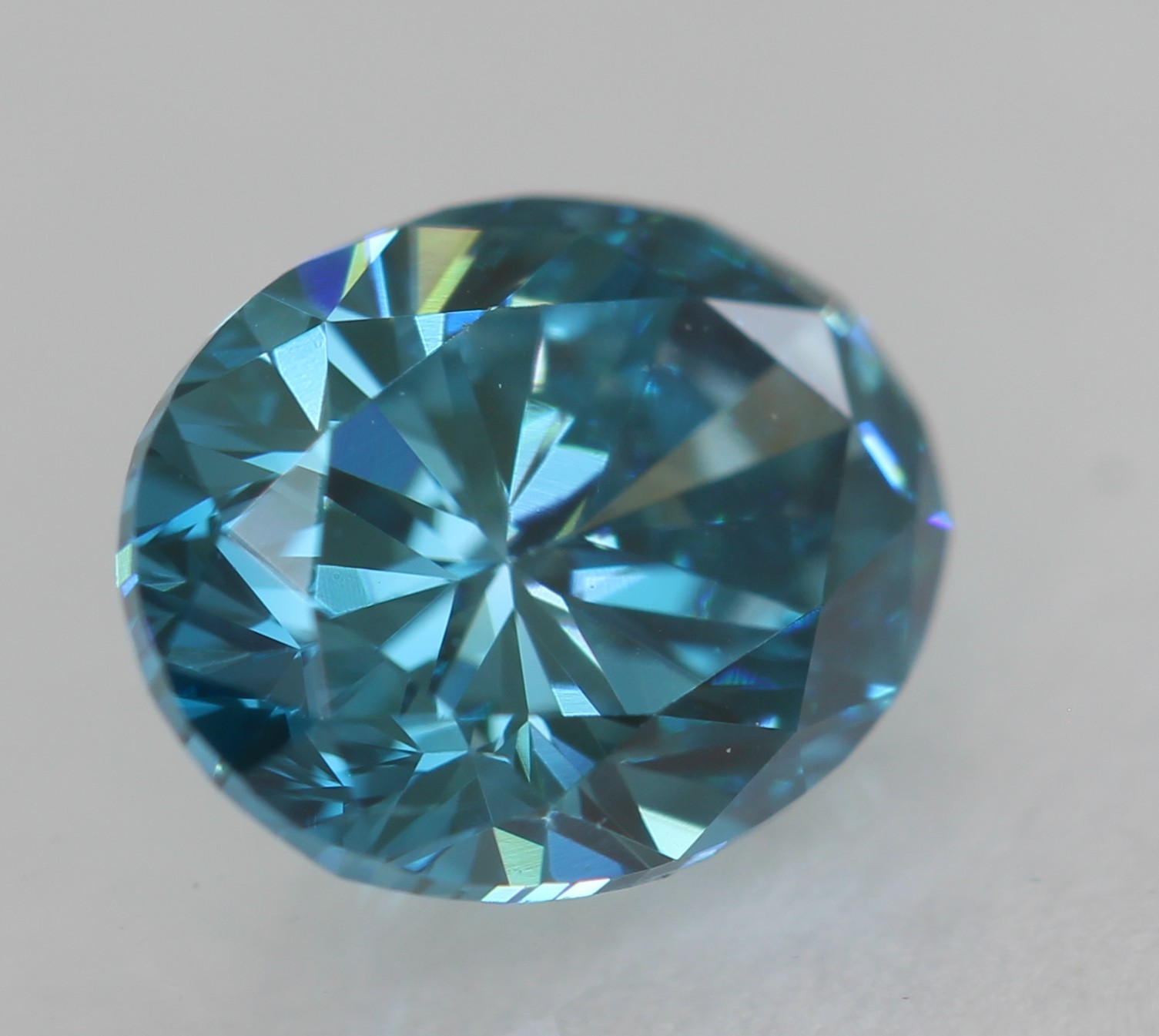 Cert 0.57 Carat Fancy Vivid Blue VVS1 Oval Natural Enhanced Diamond 5.99×4.63mm