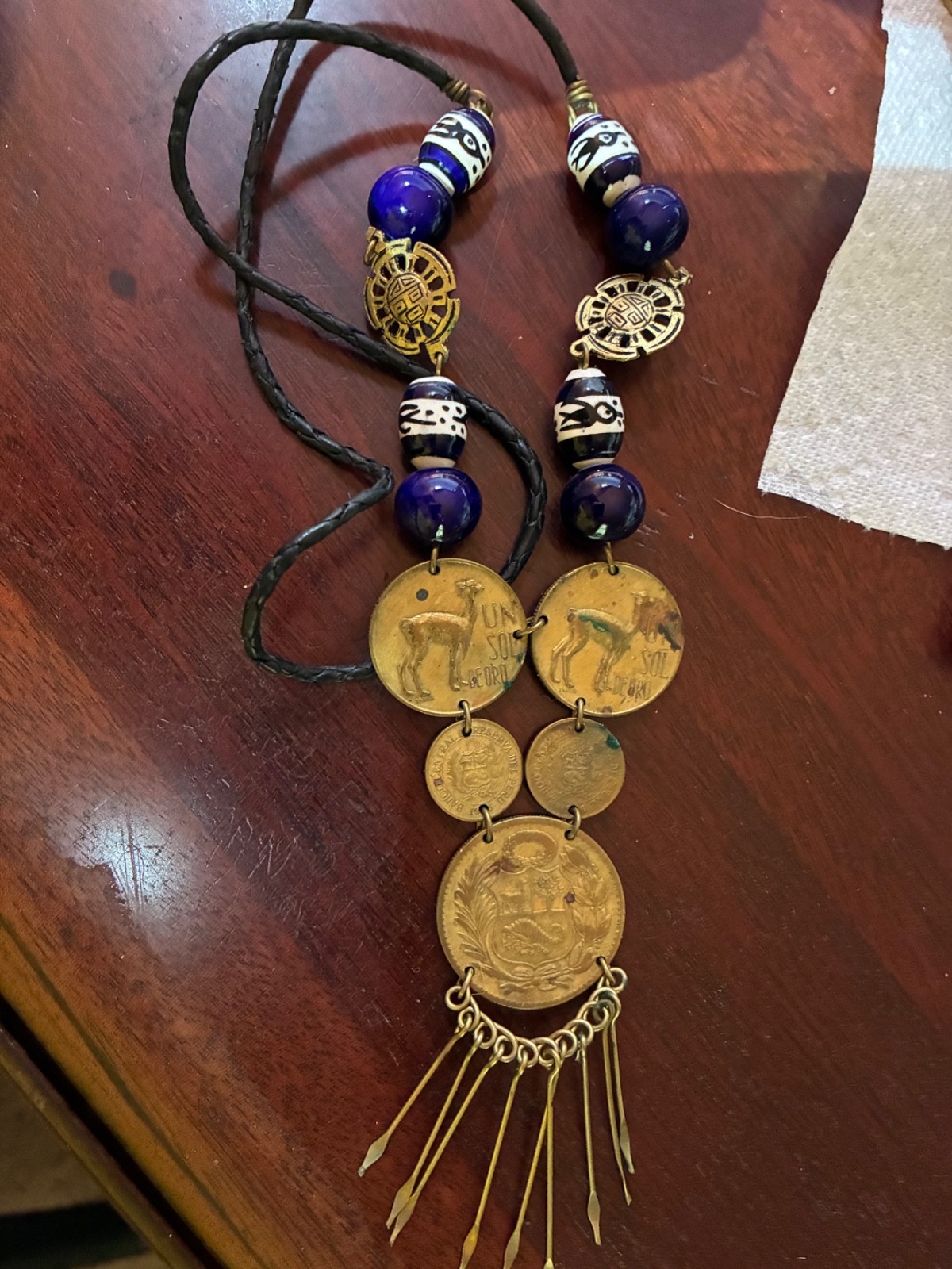 Peruvian necklace with 1946 and 1961 un sol de oro