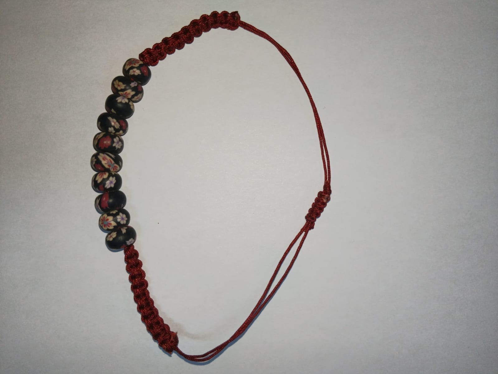 Handmade Black Millefiori Flower Bead Bracelet – Red Macrame Adjustable