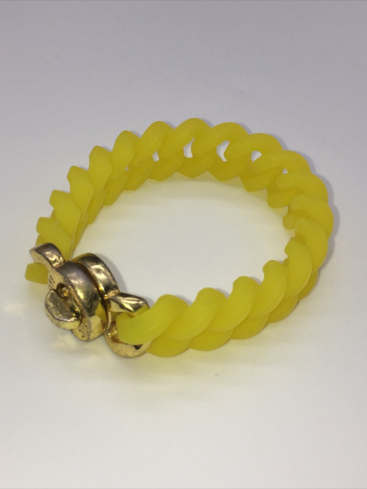 Rustic Cuff Gold Tone Logo Turn Lock Yellow Silicone Stretch Bracelet