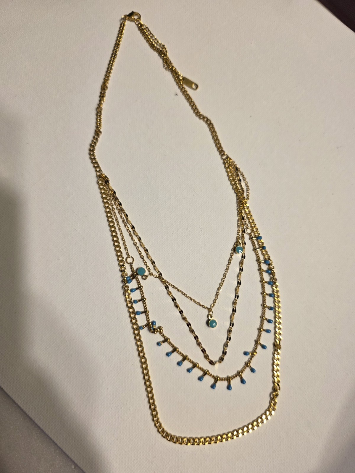 Gold Tone Layered Cable Chain Necklace with Blue Accents, Lobster Closure