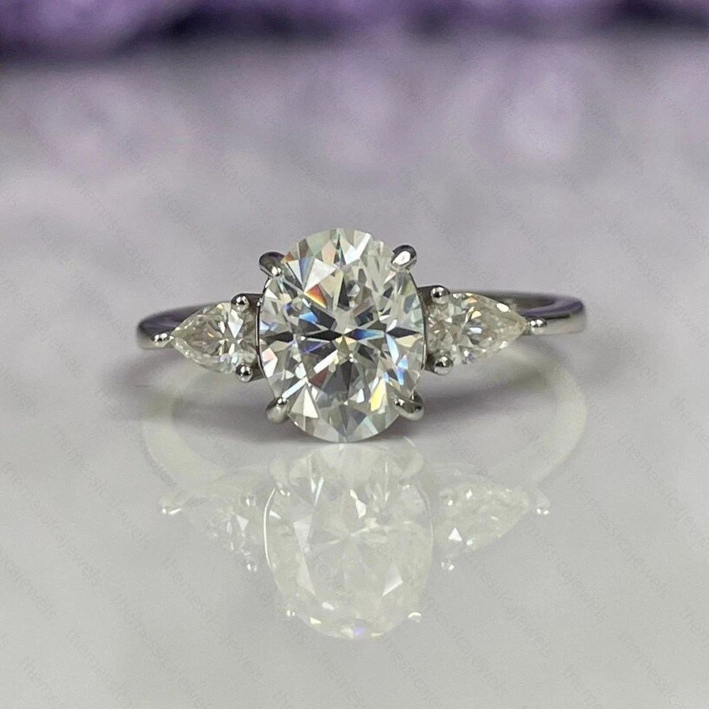 3.10 TCW Oval Cut Moissanite Three Stone Engagement Ring 14K White Gold Plated