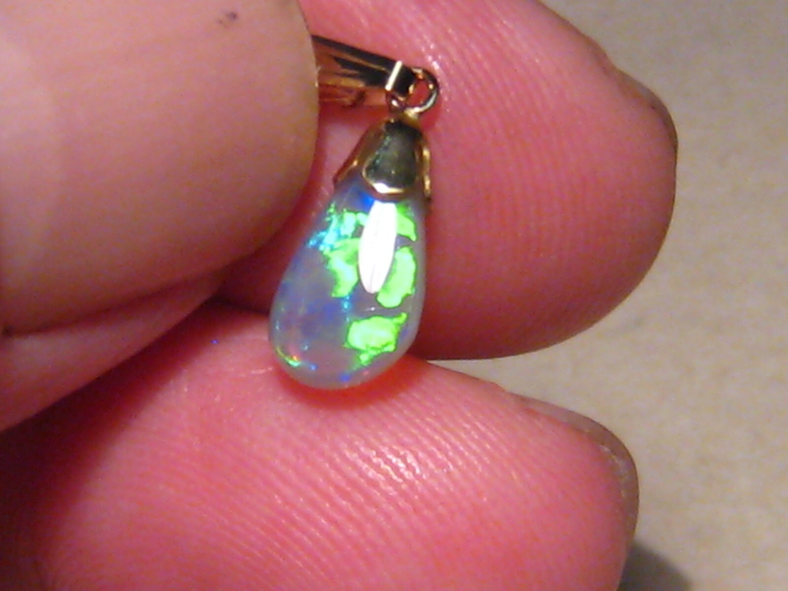.90 ct. small Bright Opal Pendant , Solid 14 k yellow gold