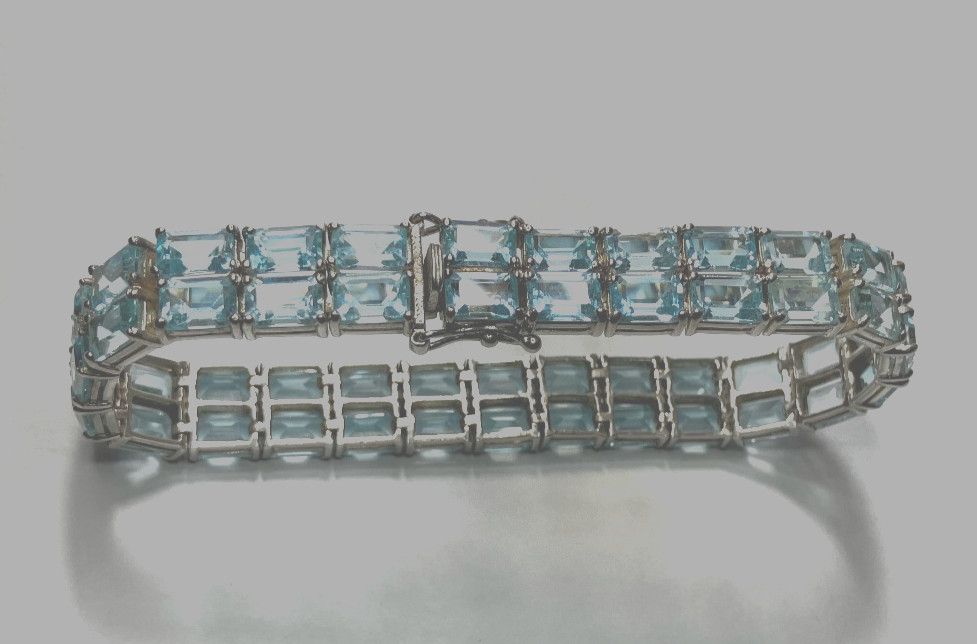 8” TENNIS BRACELET -ADI 925 STERLING SILVER – 40 EMERALD CUT TOPAZ STONES -NICE!