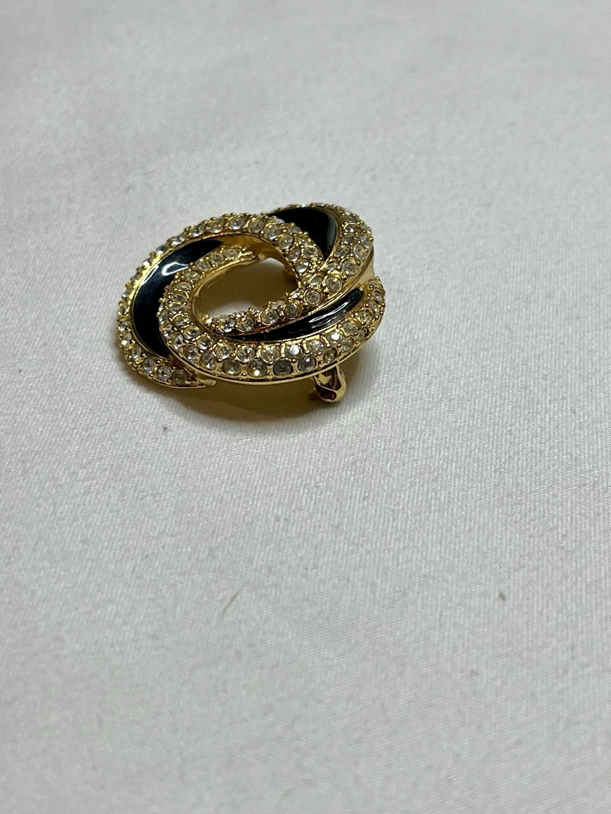 Signed Swarovski Gold Tone Clear Crystal Black Enamel Love Knot Brooch Pin