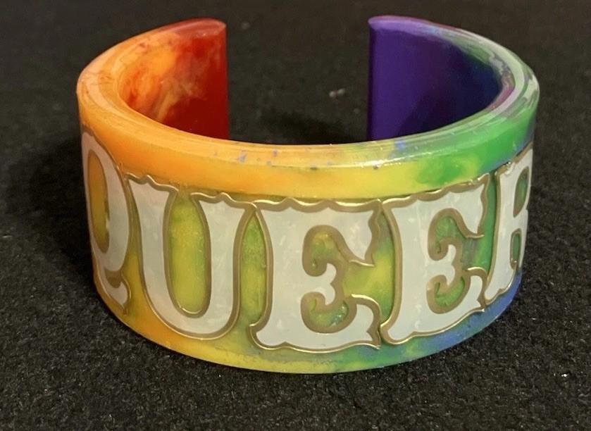 Rainbow “Queer” Cuff Bracelet, Grey And Gold Trim Text, MiaChavi Geekery