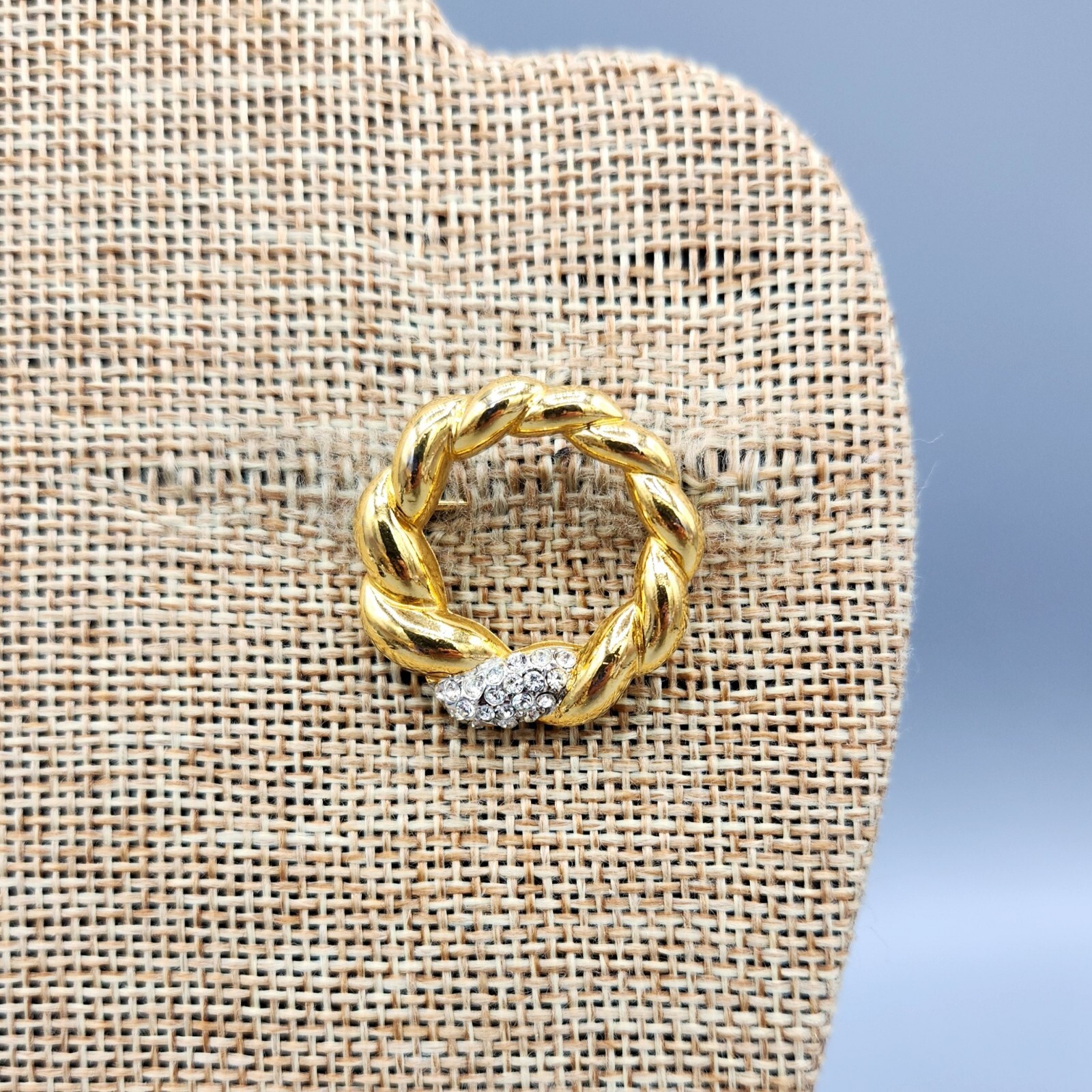 Crown Trifari Polished Gold Tone Crystal Pave Open Circle Twist Brooch