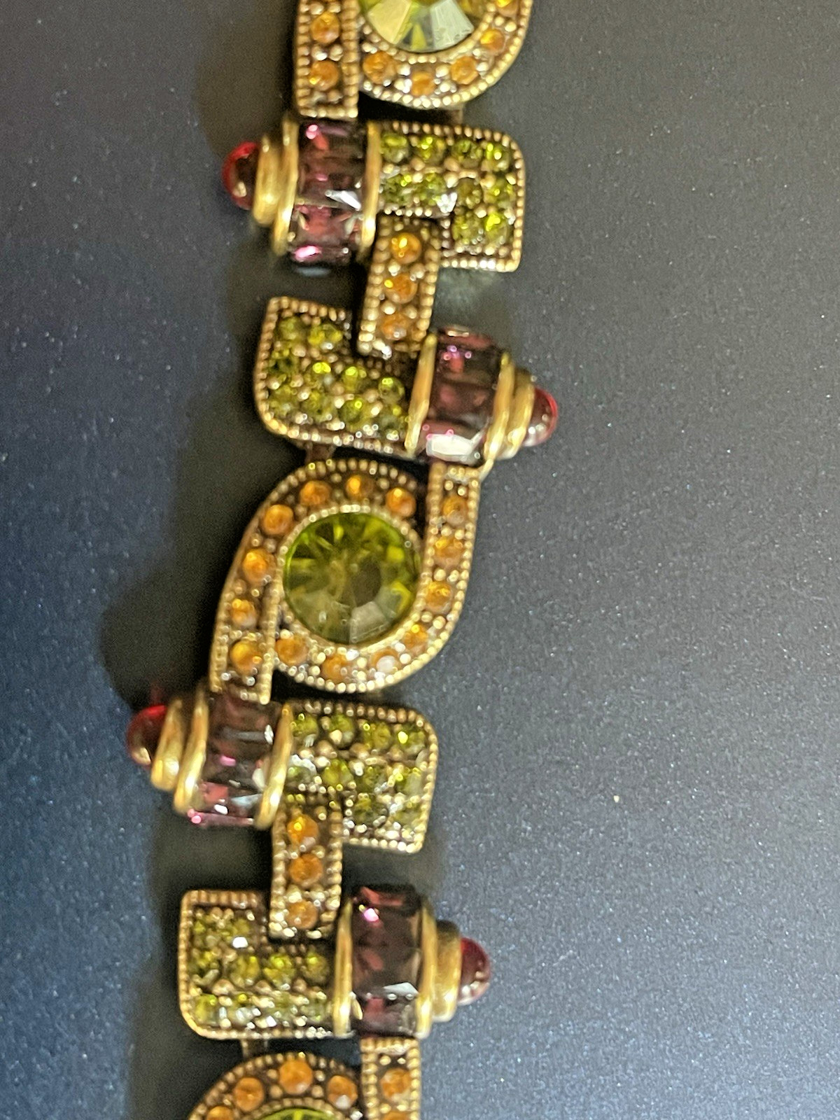 New Heidi Daus Bracelet in Original Packing. Olive Green, Red, Yellow Crystals.