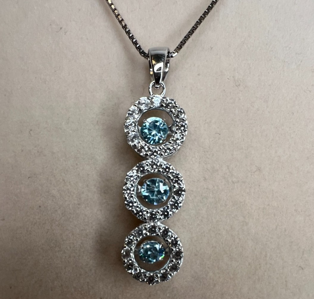 .89ctw round blue and 1.11ctw round white zircon SS pendant w chain