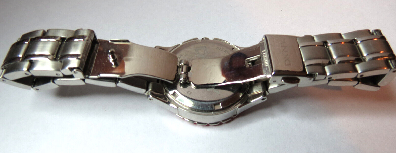NICE WOMENS DKNY QUARTZ SPORT 5 ATM PINK BEZEL WATCH FRESH BATTERY RUN’S,