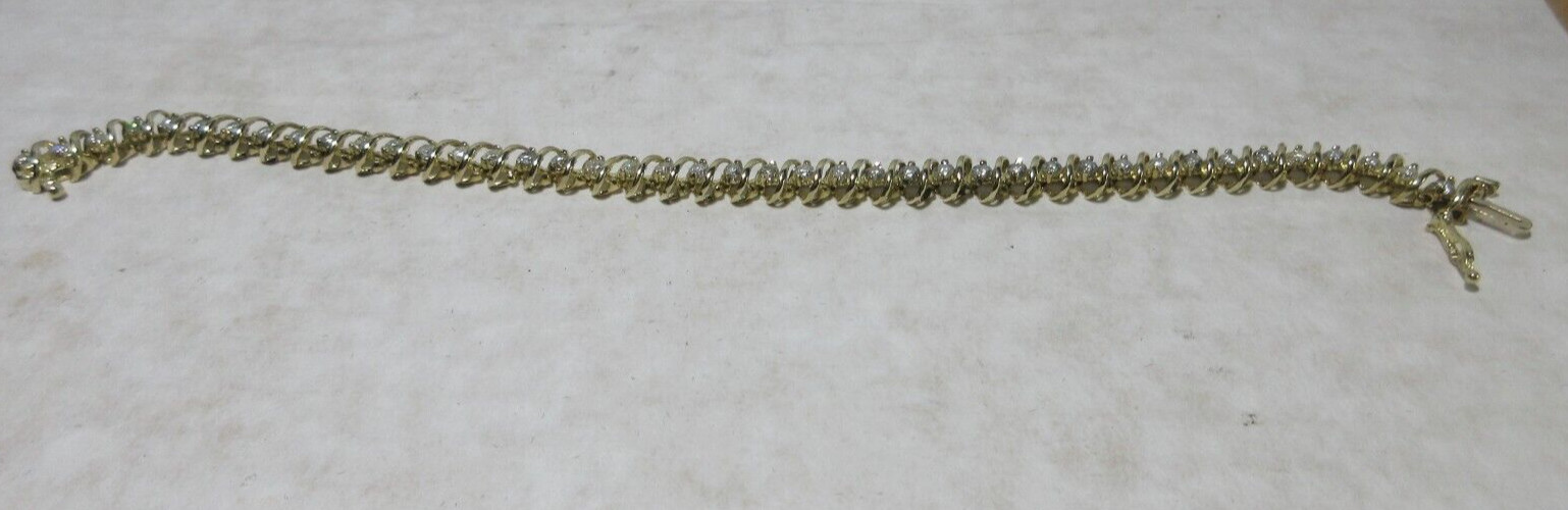 14K Yellow Gold tennis Bracelet, Wt 12.5g, locking 42 x 2.5mm diamonds si2 I1
