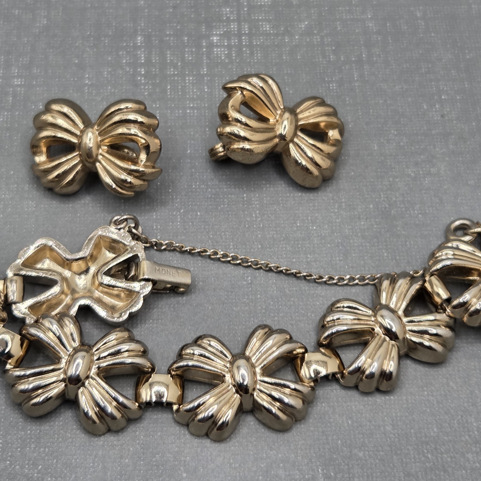 Vintage Monet Gold Tone Bow Bracelet Safety Chain And Clip On Earrings Set SEE