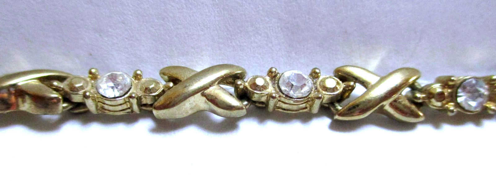VINTAGE SIGNED AVON RHINESTONE TENNIS BRACELET X’S & O’S, GOLDTONE
