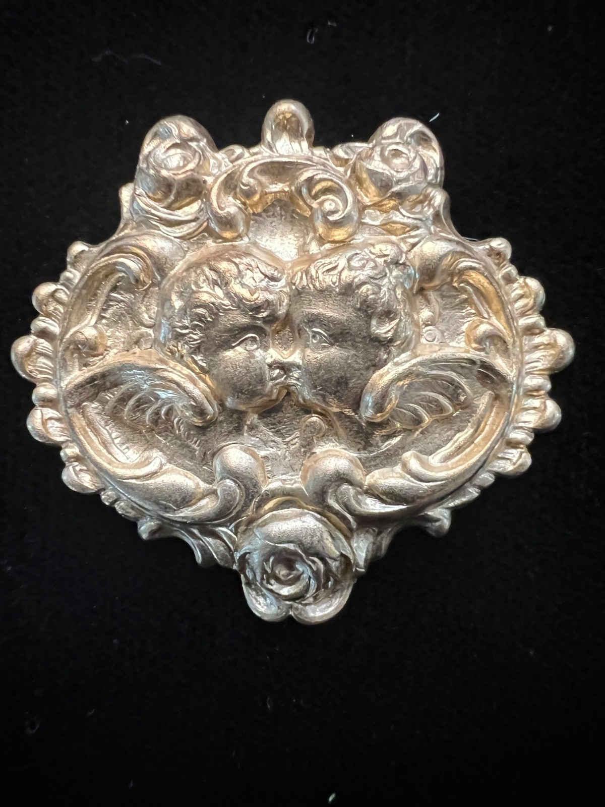 Cherubs kissing with rose detail Brass stamping. Vintage/Antique for Pin/Bolo.