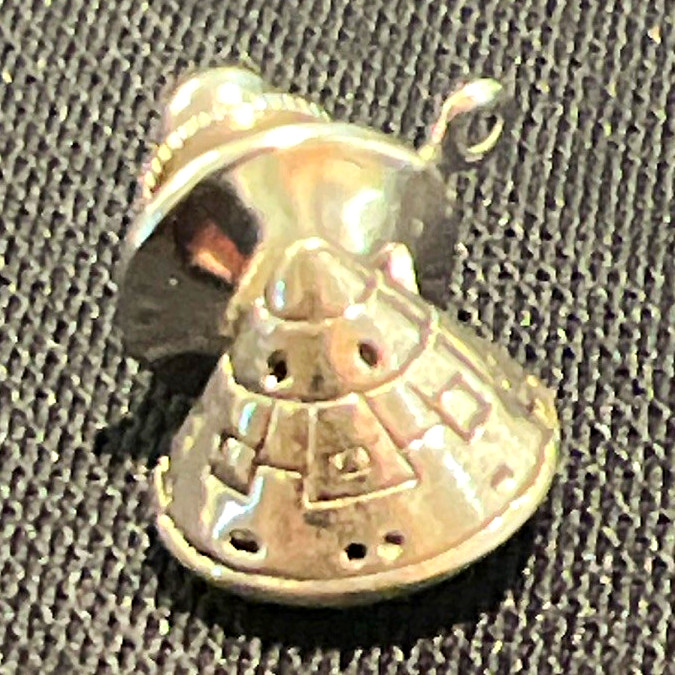 Vintage silver-tone lapel pin or tie tack NASA Apollo-style space capsule