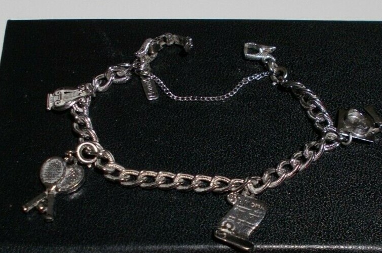 VTG MONET Bracelet with 4 Charms Size 7in Silver Ton Safety Chain 