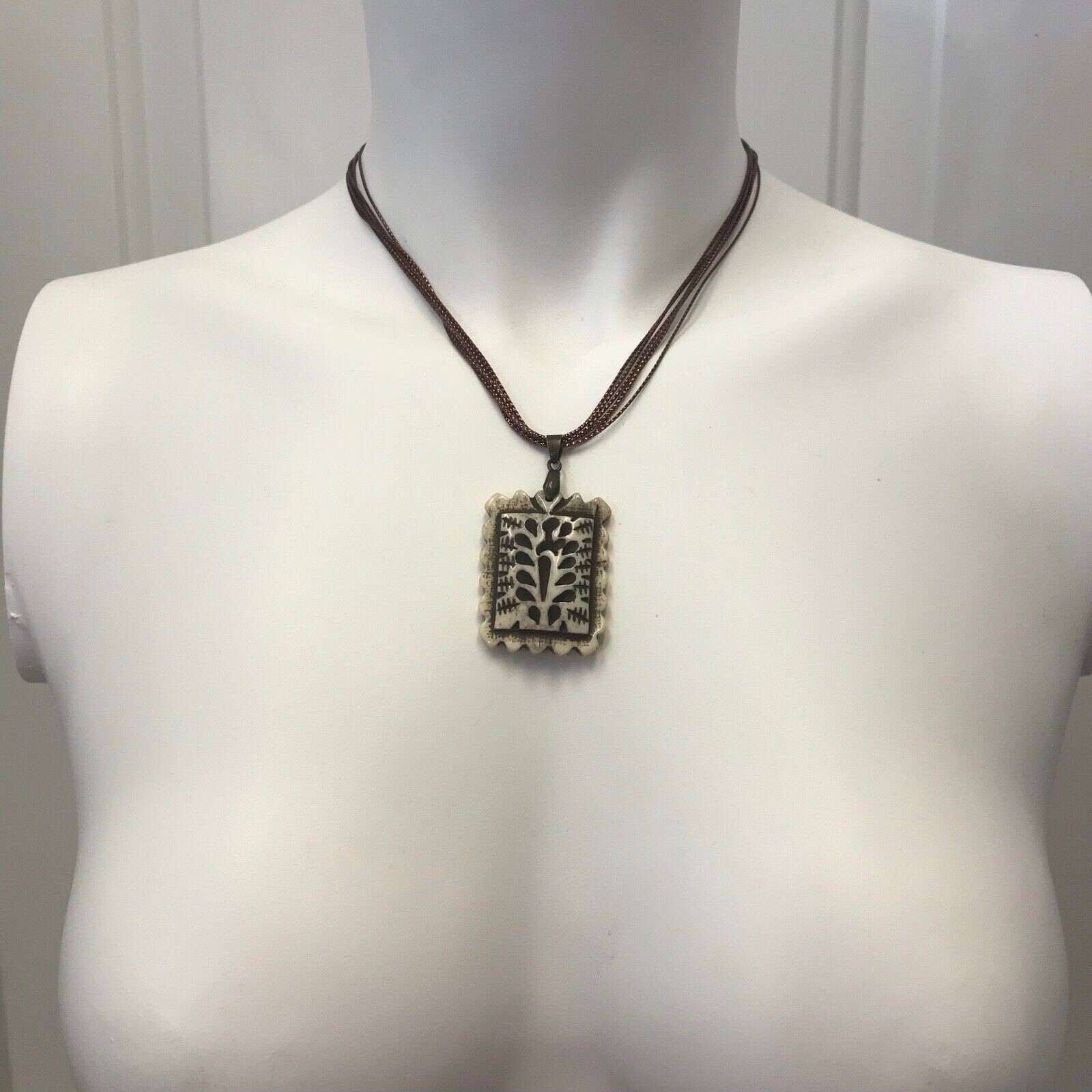 Rectangular Fluted Bone Pendant on a Bronze Tone Polyester Multi Cord Necklace