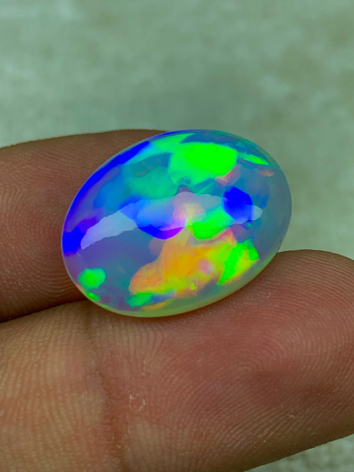 Natural Ethiopian Opal 8.30 Carat Oval Cabochon Rainbow Fire Welo Gemstone